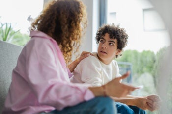 Mother and son arguing with each other at home