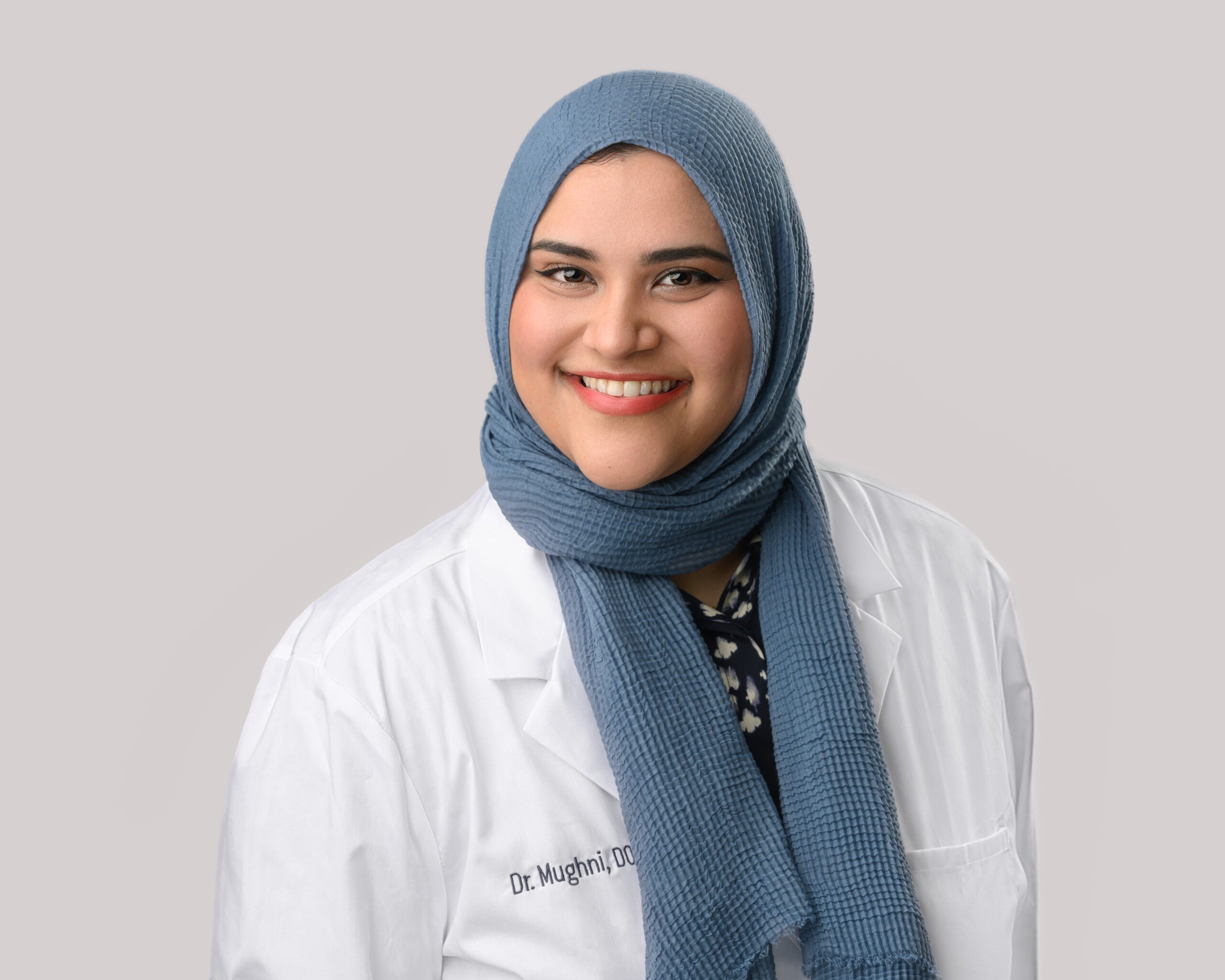 Portrait of Somiyah Mughni, D.O. in a white lab coat