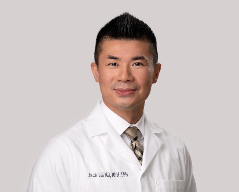 Portrait of Jack Lai, M.D. in a white lab coat