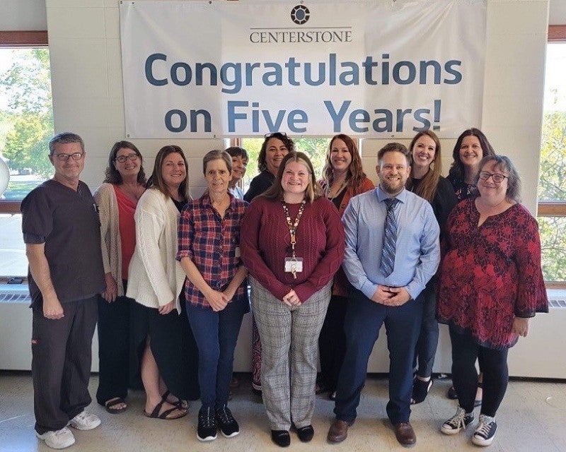 Centerstone Indiana Recovery Center 5 Years A group of clinical and administrative staff at a Centerstone Recovery Center gathered for a photo beneath a banner reading "Congratulations on Five Years!"